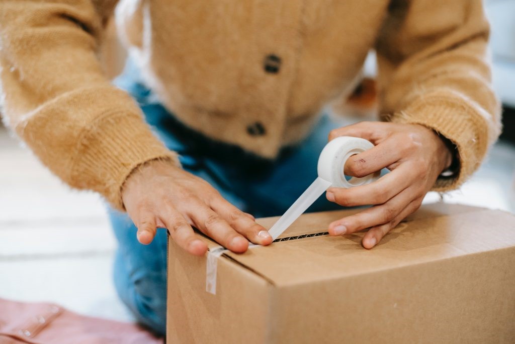 A man packaging jewellery